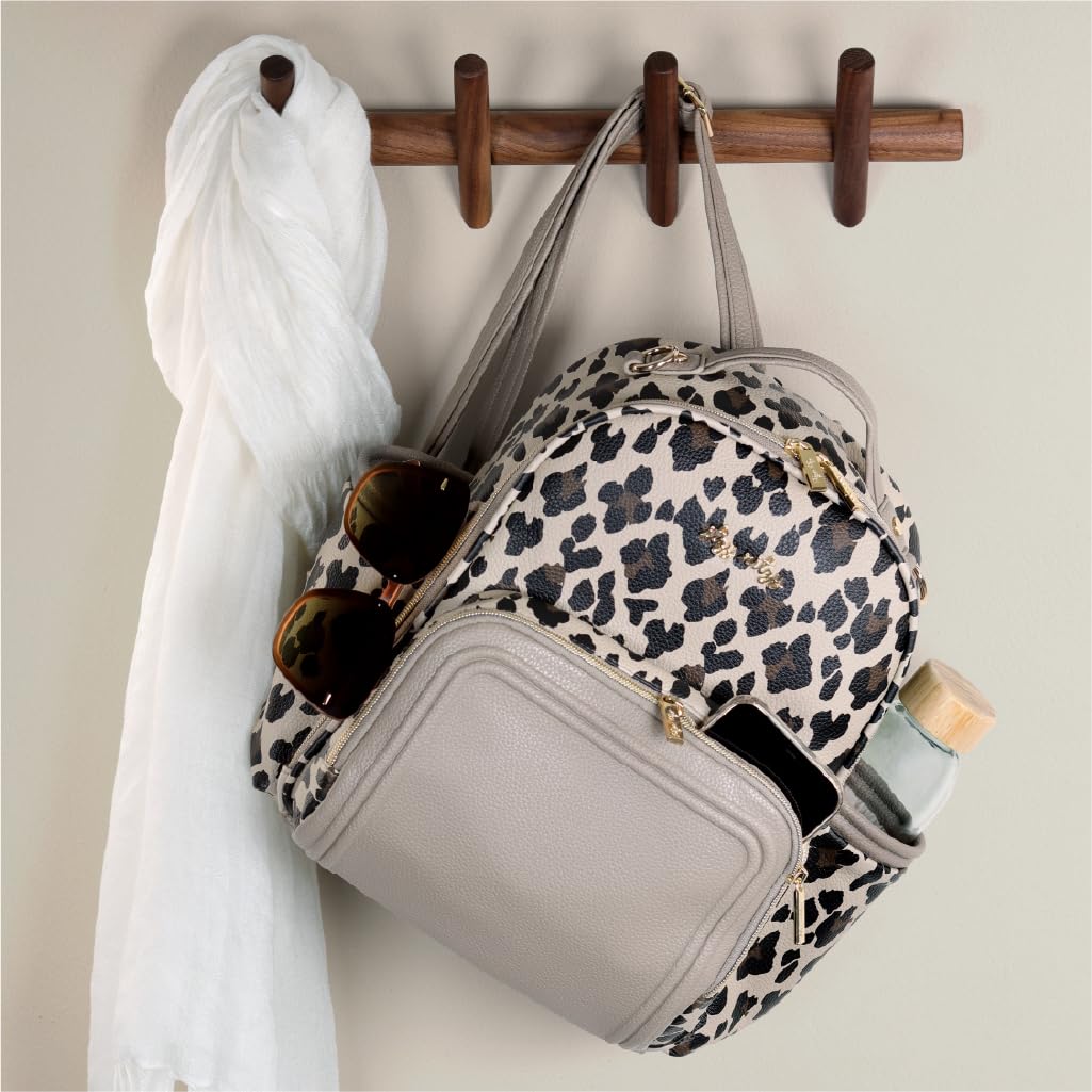 Itzy Ritzy Mini Diaper Bag Backpack – Chic, Compact Mini Plus Backpack with Changing Pad, 10 Pockets (6 Internal, 4 External), Grab-Top Handle & Rubber Feet (Leopard)
