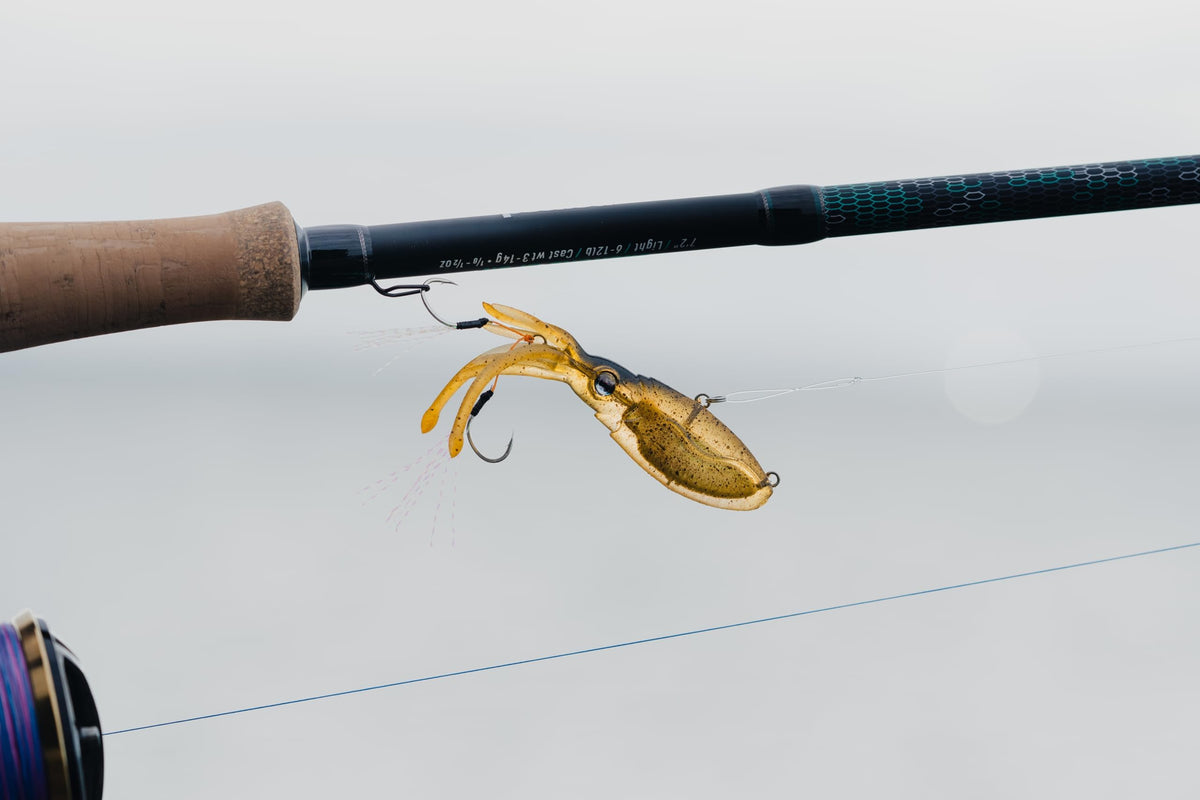 Nomad Design Squidtrex Patented Vibrating Fishing Lure- Scent Added TPE Soft Plastic Lure for Saltwater w/Strong BKK Assist Hooks, Fishing Bait that Catches Many Species, 75mm 1/2oz- Holo Ghost Shad