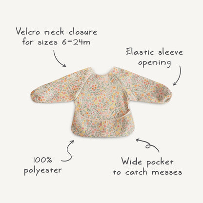 mushie Long Sleeve Baby Bib | Water Resistant Adjustable Fit for Ages 6-24 Months (Retro Flowers)