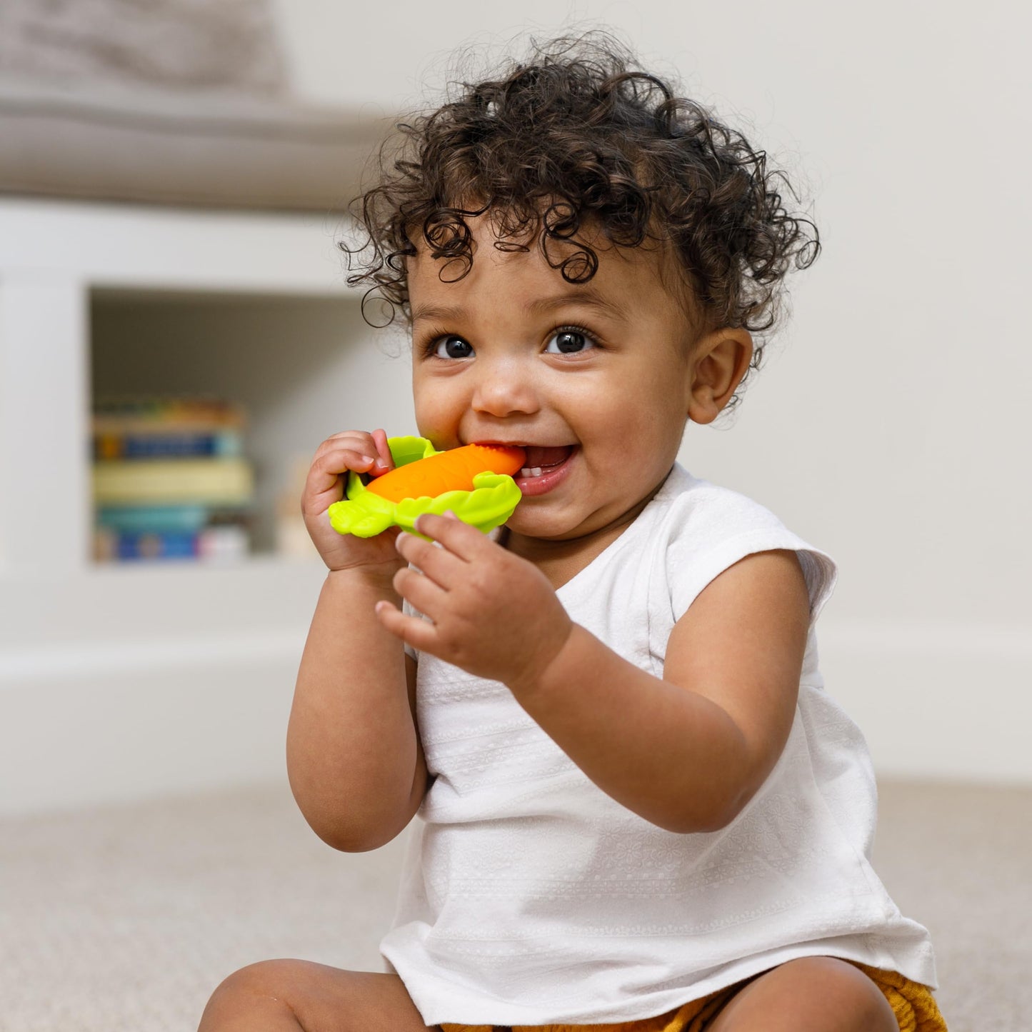 Infantino Lil' Nibbles Textured Silicone Baby Teether - Sensory Exploration and Teething Relief with Easy to Hold Handles, Orange Carrot, 0+ Months