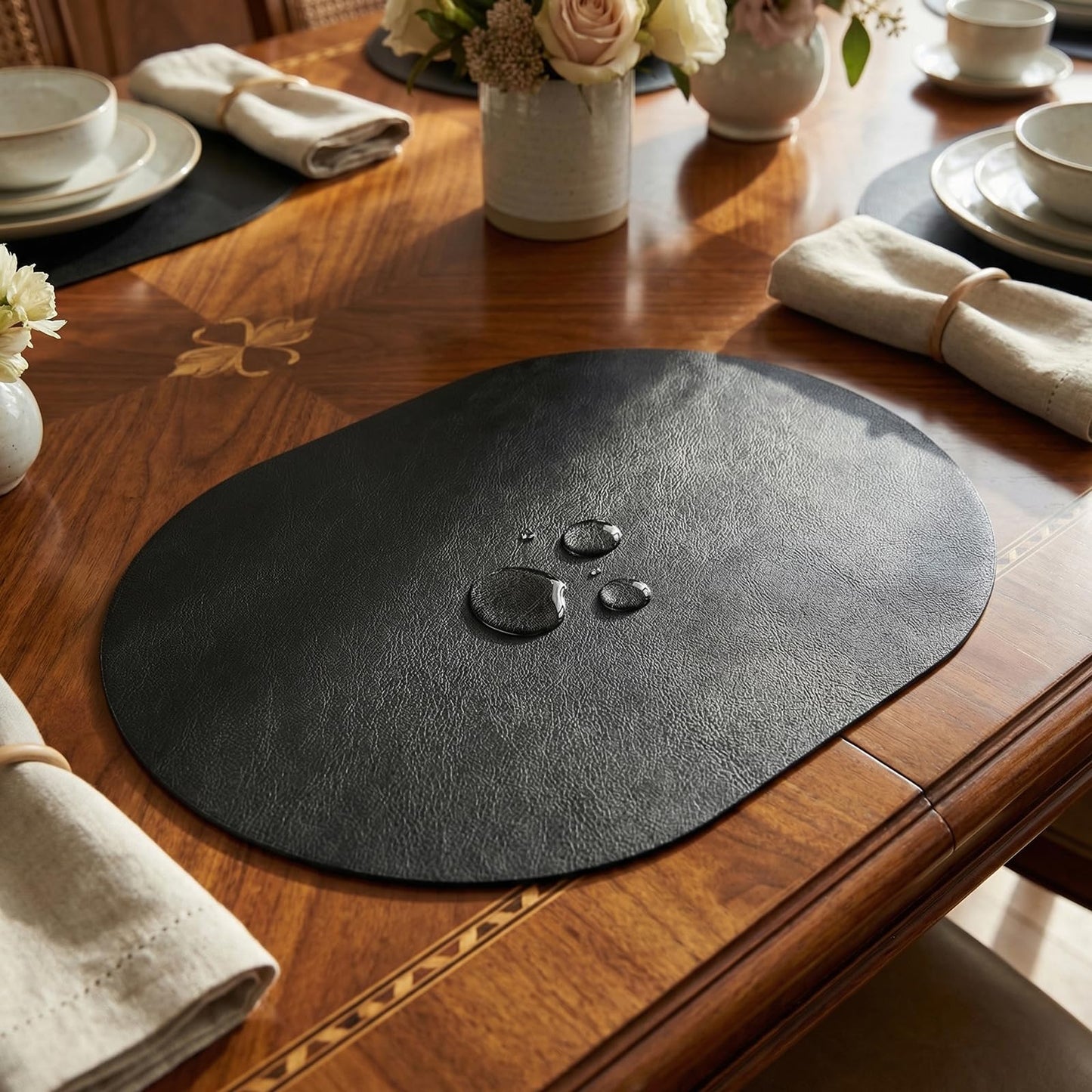 BIPASION Oval Placemats 2mm Ultra Thick Faux Leather Table Mats, Heat Resistant Waterproof Wipeable Dining Mats for Kitchen Table, Set of 8, Black