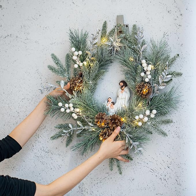 YULETIME 20" Pre-Lit Nativity Wreath, Battery Operated with 10 Fairy Lights, Holy Family Nativity Statue, Star of Bethlehem, Pine Cones, White Mistletoe, Frosted Spruce Branches (Nativity Frosted)